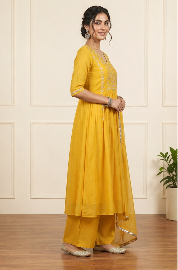 Haldi Yellow Mul Chanderi Suit Set side view showcasing graceful drape, intricate detailing and rich yellow color