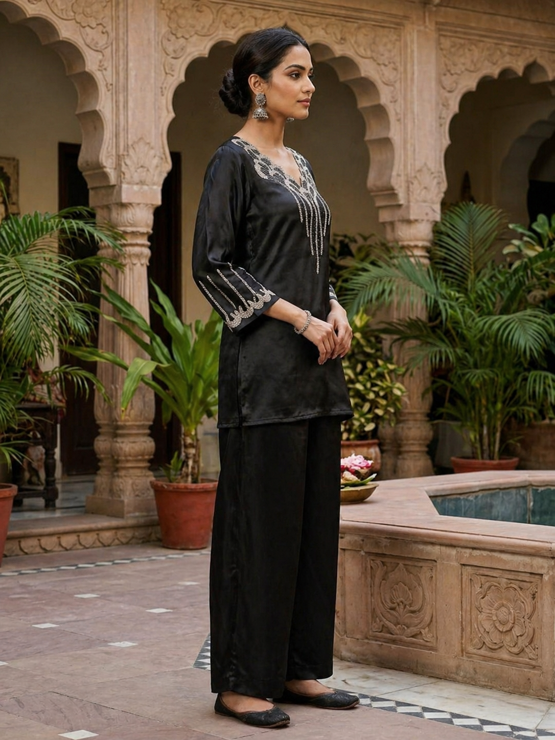 Black satin silk monochromatic co-ord set for women — side view showing mirror-like fabric drape, luxurious silhouette and starlit bead embellishments

